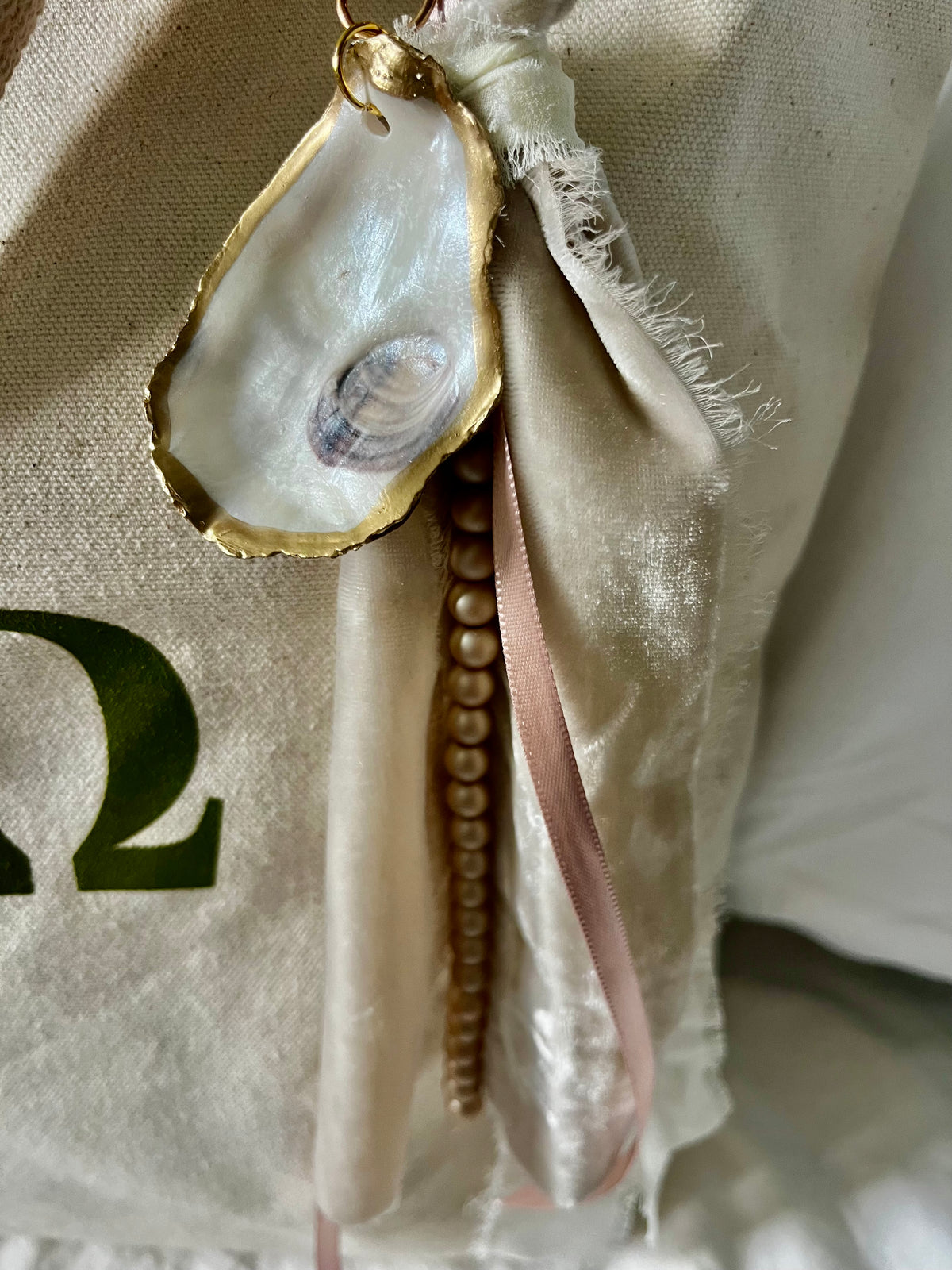 Soft and romantic velvet ribbon and pearls oyster shell bag charm