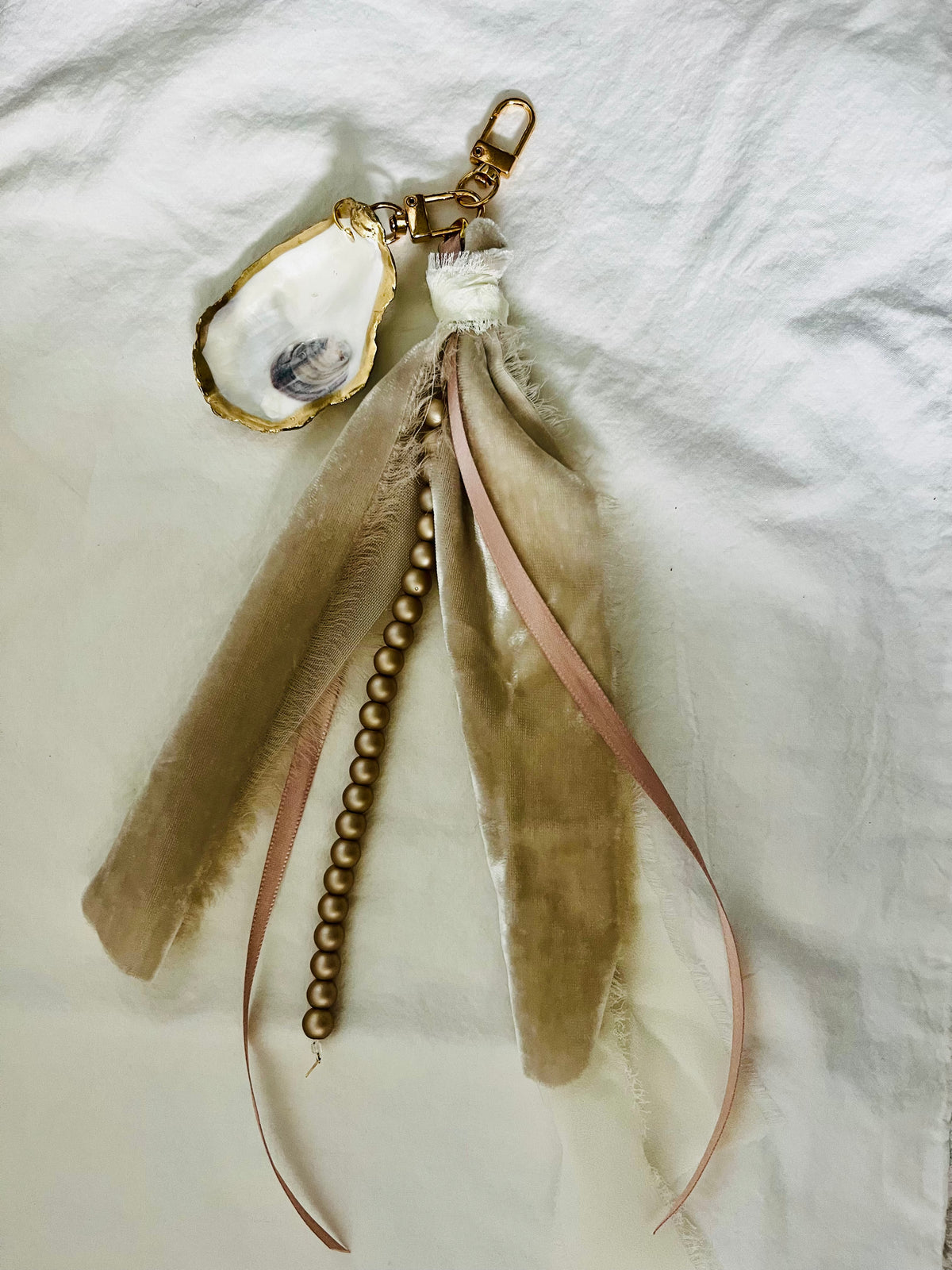 Soft and romantic velvet ribbon and pearls oyster shell bag charm