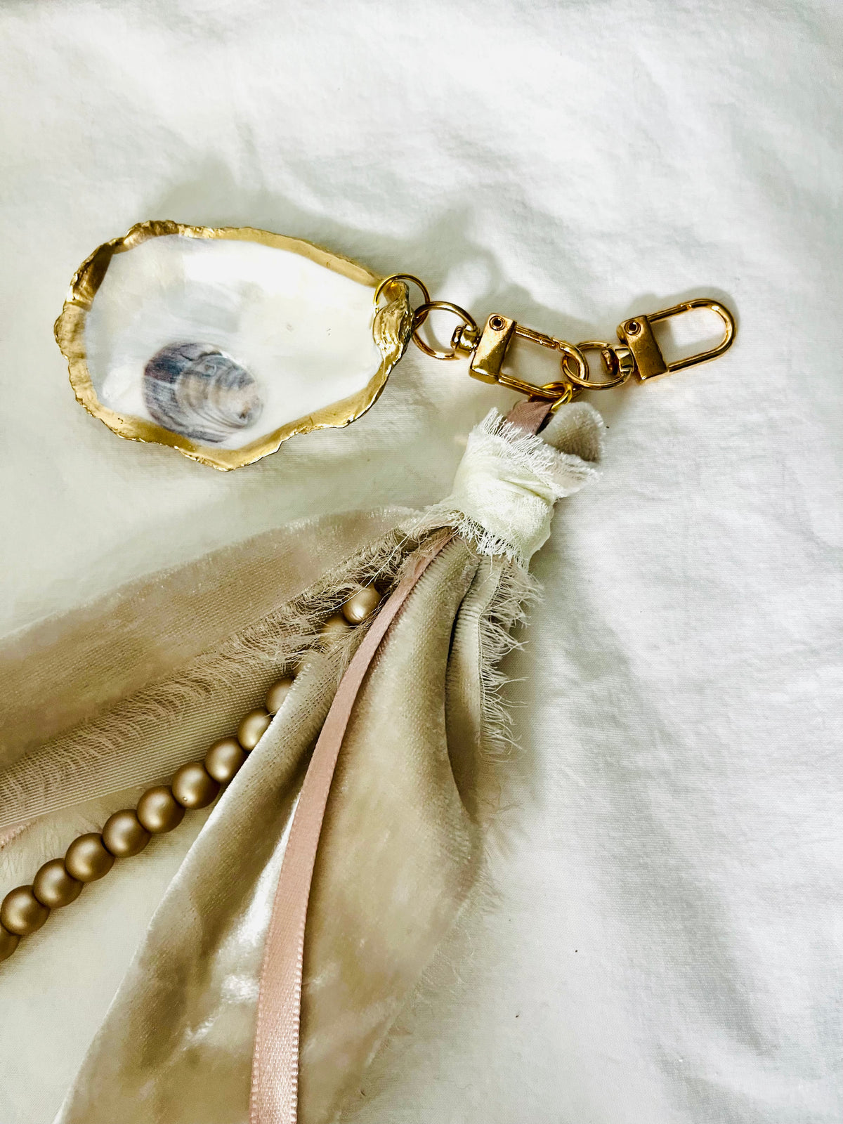 Soft and romantic velvet ribbon and pearls oyster shell bag charm